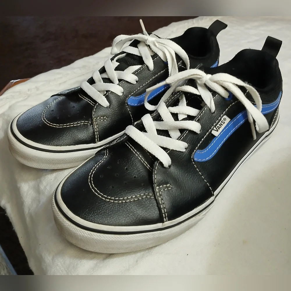 Vans Black Sneakers with Blue Accents and White Laces